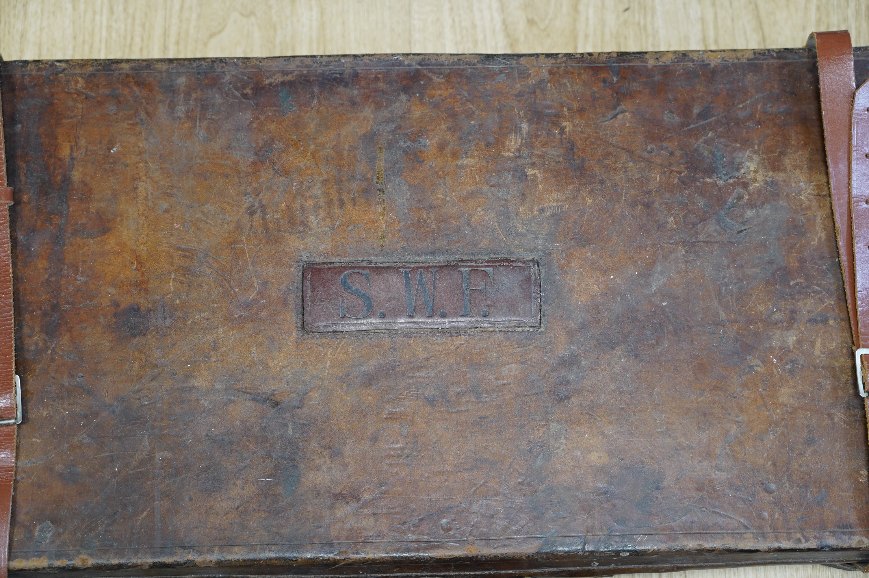 Two leather gun cases, largest 85cm wide, 34cm deep. Condition - fair considering age and use